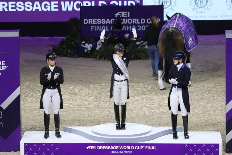 On the podium after the Grand Prix Freestyle – Germany’s Jessica von Bredow-Werndl (center) is crowned champion for a second consecutive year with super mare TSF Dalera BB, with an amazing score of 90.482%!! Denmark’s Nanna Skodborg Merrald (right) and Blue Hors Zepter took home second place honors with a 87.146%, and Germany’s Isabell Werth and DSP Quantaz were third with 85.761%. Photo by Chelsey Burris